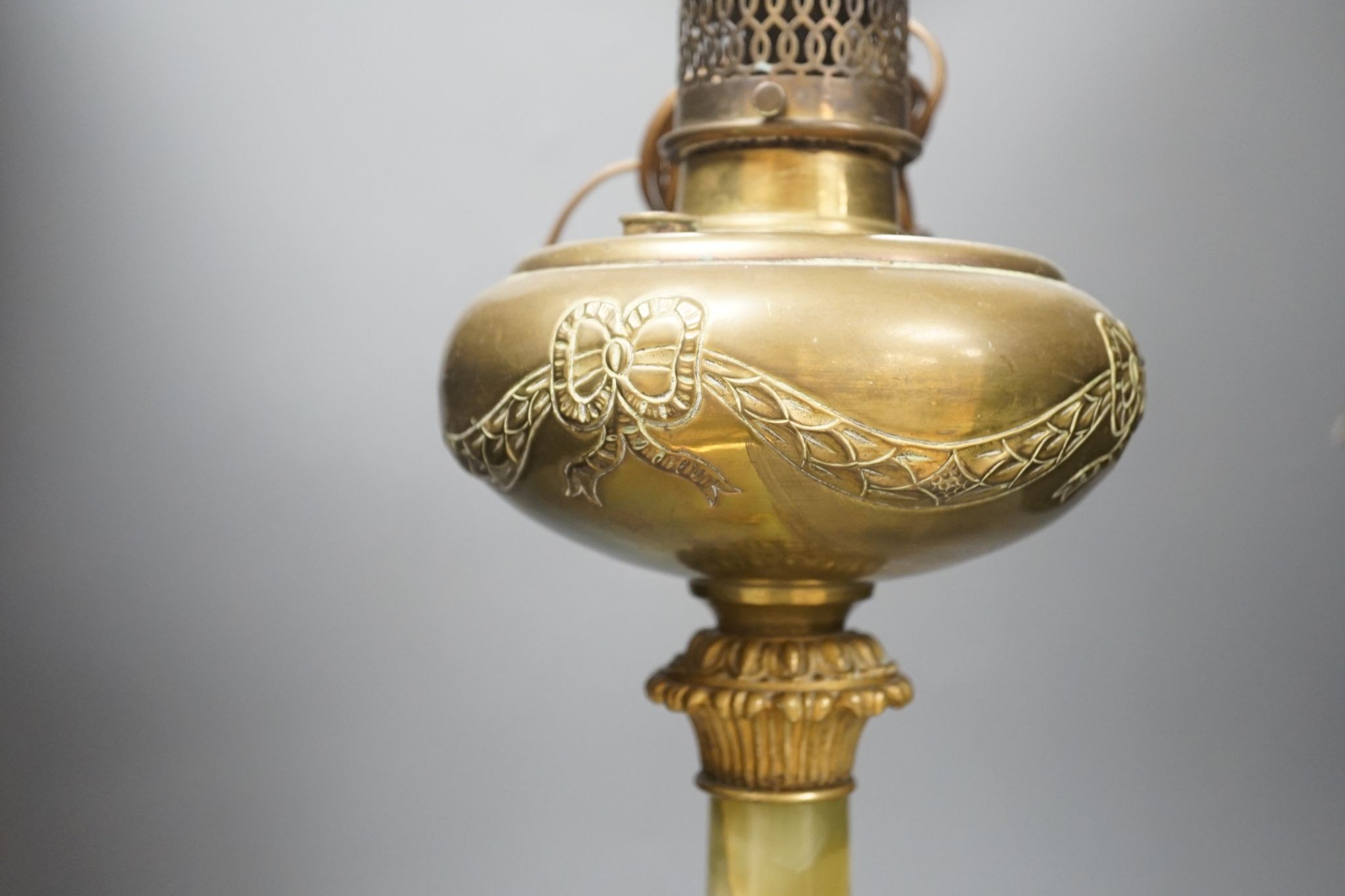 A French gilded bronze and green onyx oil lamp (converted to electricity later), 84 cms including light fitting.